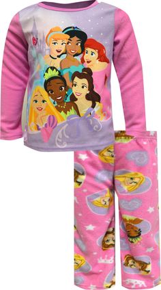 Six of your favorite smiling princesses are all the focus on these flame resistant pajamas for girls. Pretty in pink, these jammies feature Rapunzel, Tiana, Belle, Jasmine, Cinderella and Ariel on the top and are paired with adorable tiara and heart patterned pants. Made of super soft 100% polyester fleece, they are machine wash and easy care. Character Print Long Sleeve Sleepwear For Pajama Party, Pink Character Print Sleepwear For Loungewear, Character Print Long Sleeve Sleepwear For Sleepover, Pink Character Print Pajama Party Set, Pink Long Sleeve Sleepwear With Cartoon Print, Disney Style Pink Sleepwear For Bedtime, Pink Disney Sleepwear For Bedtime, Long Sleeve Character Print Sets For Sleepovers, Long Sleeve Sets With Character Print For Sleepover