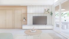 a living room filled with furniture and a flat screen tv on top of a wooden stand