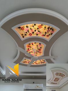 the ceiling has been decorated with flowers and leaves in shades of pink, orange, yellow and white