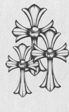 a drawing of three crosses on a piece of paper