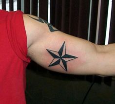 a man with a star tattoo on his arm