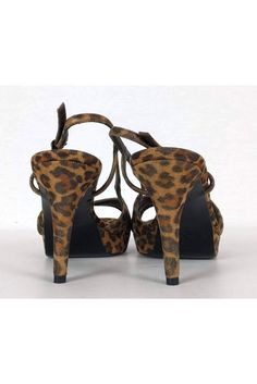 Bring out your inner wild side with these fabulous animal print pumps. Specs of gold on the upper add a shimmering touch. Perfect to pair with any little black dress for a night out on the town. Size 9 M Animal print upper w/ gold specks Leather sole Made in Spain Covered heel Gold-tone side buckle Light wear on sole Platform height .75" Heel height 4.25" Elegant Leopard Print Heels For Party, Leopard Print High Heels For Night Out, Formal Leopard Print Heels With Ankle Strap, Party Platform Heels In Leopard Print, Chic Leopard Print Heels For Night Out, Party Leopard Print Platform Heels, Leopard Print Evening Heels For Spring, Spring Evening Leopard Print Heels, Leopard Print High Heel Evening Heels