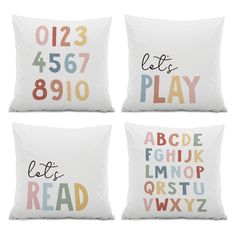 four pillows with different letters and numbers on them