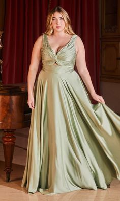 This beautiful plus-size long prom dress proves that a rich design doesn't have to be expensive. Budget-priced under $150, this upscale plus-size evening gown highlights the curves from the deep v-neckline to the hem for an eye-catching look at prom, galas, and other black-tie events. A twist-front detail and a reverse triangle cut-out add a sexy vibe to this plus-size formal dress, while bra-friendly shoulder straps lead to the matching v-back. A ruched band tops the long a-line skirt that fini Cinderella Divine, Plus Size Prom, Satin Evening Dresses, Keyhole Dress, Sophisticated Dress, Strapless Gown, A Line Gown, Flowy Skirt, Evening Dresses Long