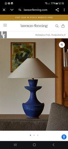 a blue lamp sitting on top of a table