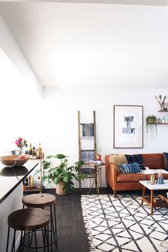 a living room filled with furniture and decor