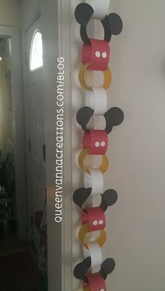 a mickey mouse decoration hanging on the wall next to a clock and door with an instagram message about it