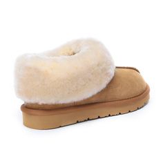 This cozy slipper with a central seam and a full collar offer an invitation to indulge in unparalleled comfort. Crafted with a lining and insole made from Sheepskin, it provides breathable warmth for chilly feet. Specification: Suede Upper Warm Sheepskin Wool Lining Soft Sheepskin Wool Insole Eva Sole Technologies: Water Resistance Upper Light Weight Outsole Classic Closed Toe Slippers With Removable Insole, Winter Soft Sole Slip-on Slippers, Classic Slip-on Slippers With Textured Footbed, Indoor Slippers With Removable Insole And Round Toe, Indoor Slippers With Round Toe And Rubber Sole, Indoor Slippers With Rubber Sole And Round Toe, Comfortable Slippers With Leather Sole And Round Toe, Slip-on Slippers With Round Toe For Indoor, Comfortable Leather Slippers With Round Toe