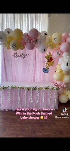 winnie the pooh balloon arch for a baby shower