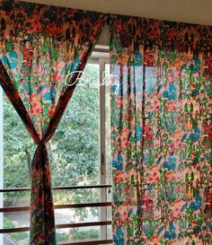 the curtains are open and ready to be hung in front of the window with an outside view