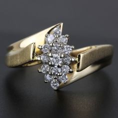 We Have For Sale This 14k Vintage Diamond Cluster Ring. This Ring Has 15 Round Diamonds For A Total Of .42 Carats In Diamonds. It Also Has Brushed Sides And It Is Stamped "Exquisite" Size: 6.75 Weight: 2.11 Dwt/3.28 Grams Metal: 14k Yellow Gold Stones: 15 Round Diamonds For .42ctw I-2740 Lo*Scx* G-279 Diamond Cluster Ring, Diamond Cluster, Vintage Diamond, Cluster Ring, Womens Jewelry Rings, Round Diamonds, Diamonds, Yellow Gold, Women Jewelry