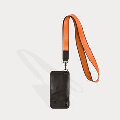 The Ryder Lanyard features an 20.5" orange nylon and black leather detachable lanyard strap that adds a dynamic style pop to any outfit. Worn easily around the neck, or with the lanyard exposed and the case tucked in a pocket. This sport style provides the perfect accent to any contemporary look. OPEN-FACE WITH SNAPBACK COVER - Open-face design gives easy access to your screen; Stylish rear pocket with snap conceals and protects your credit cards, driver's license and cash. GENUINE LEATHER - Lux Adjustable Black Lanyards For Everyday Use, Wallet Lanyard, Sport Style, Wearable Technology, Face Design, Functional Design, Sport Fashion, Cell Phone Cases, Iphone Xr