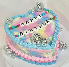 a birthday cake decorated with disco balls and the words happy birthday