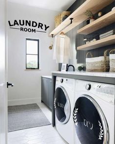 a washer and dryer in a laundry room with shelves above the washer