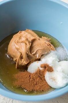 a bowl filled with different types of food and some powdered sugar in it on top of a table