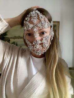 Silver Rhinestone Face Mask A silver crystal filigree mask that would be perfect for raves, festivals and weddings! This gorgeous face mask is designed with clear rhinestones, and crystals You will be the center of attention with these sparkling jewels at a party or to your wedding! This crystal it looks amazing under stage lights. The mask is fixed at the back with a chain Silver Headpiece, Bridal Crown Crystal, Face Chain, Face Rhinestones, Rhinestone Face, Rhinestone Face Mask, Silver Earrings Wedding, Rave Mask, Crystal Crown Wedding