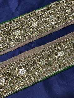 two pieces of cloth with beading on them