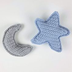 two crocheted stars and a crescent on a white background, one is blue and the other is gray