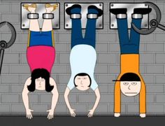 three people are hanging upside down in front of a brick wall and some metal hooks