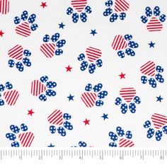 a white background with red, white and blue stars on the top of it is next to a ruler