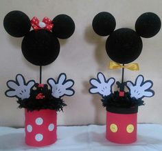 two mickey and minnie mouse centerpieces on display