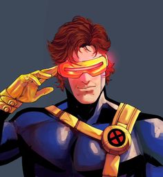 a man with red hair and goggles holding his hand to his face while wearing a yellow mask