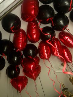 red and black balloons are on the floor