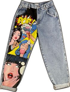 a pair of jean pants with cartoon images on them