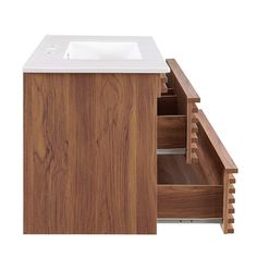 a bathroom vanity with wooden drawers and a white counter top, against a white background