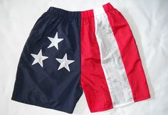 American Flag Walking shorts are great way to show how much you love America. Stately shorts are made by color blocking the fabric and the stars are appliqued on. Shorts have approximately a 6 inch inseam.   Stately shorts are often seen worn by men and gals. Lots of groups wear or shorts to show pride for the USA.  Made in America and shipping is free, no hidden charges. Walking Shorts, Love America, Flag Outfit, Texas Flags, Jacket Design, Oklahoma City, Made In America, In America, Short Outfits