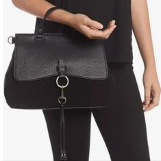 New Versatile Medium Chic Black Grained Leather And Suede Satchel For Any Occasion With Detachable, Adjustable Length Strap Featuring Shiny Silver Hardware Hook And Magnetic Button Closure. Perfect Size For All Your Essentials. Use As A Cross Body, Shoulder Bag Or Elegant Trendy Handbag For A Night Out. Interior Has 1 Zippered Compartment, 2 Pockets For Organization. 12.5" Drop Strap With Silver Button Detail 9"H 12.5"W 4.5"D Imported Leather Chic Evening Satchel With Leather Trim, Elegant Black Satchel With Leather Trim, Chic Black Satchel With Leather Trim, Chic Black Bag With Leather Trim, Black Top Handle Flap Bag With Silver-tone Hardware, Black Leather Flap Bag With Silver-tone Hardware, Black Leather Shoulder Bag With Silver-tone Hardware, Black Crossbody Shoulder Bag With Silver-tone Hardware, Black Nylon Shoulder Bag With Silver-tone Hardware