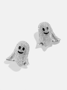 two silver ghost earrings with black eyes and white crystals on the ears, one is smiling