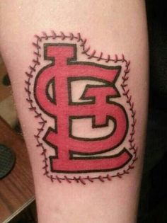 a baseball tattoo with the letter e on it