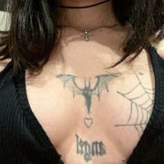 a woman with a tattoo on her chest