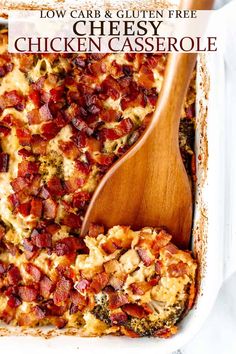 a casserole dish with bacon and cheese in it, topped with a wooden spoon