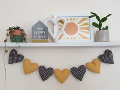 there is a shelf with some decorations on it and a coffee mug in the middle