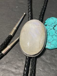 *Moonstone Bolo tie with silver tips *Sterling Silver *Free Shipping *Handcrafted In USA *Jewelry ship in Gift box * Ready to ship * Rainbow Moonstone Cabochons bolo Thank You For Your Looking ,And Check Out More Items In My Etsy Shop For More Great Deals, Also We Add More Jewelry To Etsy Shop regularly PLEASE check their dimensions, before setting the order. NOTE -Once the parcel gets shipped out, it is usually needed 3-6 business days for every where in US Please keep in mind that once your pa Adjustable Moonstone Jewelry With Round Stone, Adjustable White Artisan Jewelry, Adjustable Artisan White Jewelry, Adjustable White Gemstone Jewelry, Adjustable Moonstone Jewelry For Formal Occasions, Adjustable Sterling Silver Jewelry With Large Stone, Classic Adjustable Jewelry With Natural Stones, Adjustable Silver Moonstone Ring With Large Stone, Silver Adjustable Moonstone Ring With Large Stone