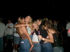 a group of young women standing next to each other