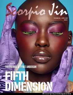 a woman with purple and green makeup on the cover of an issue of fashion magazine