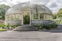 a glass house with steps leading up to it