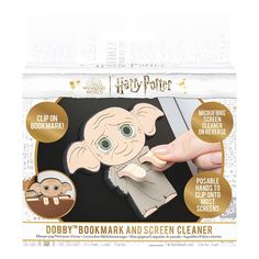 the harry potter bookmark and screen cleaner is being held by someone's hand