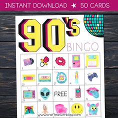 the printable 90's bingo game is shown on a wooden table