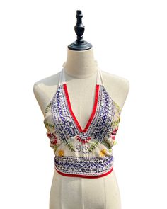 This vibrant, hand-embroidered bikini halter top offers stylish Boho-inspired fashion with its colorful threads and sequin embellishments. Paired with jeans or a skirt, this is the perfect summer top to stand out in and make a statement. The lining is a contrasting color to give it a unique, eye-catching look. One Size Made in India Care Instructions: Dry clean only Girl In The Mirror, Colorful Threads, Fur Purse, Inspired Fashion, The Mirror, Summer Top, Bright Orange, Perfect Summer, Halter Top