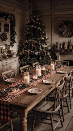 a dining room table set for christmas dinner