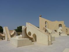 an outdoor area with stairs and buildings in the background