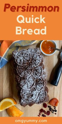 a wooden cutting board topped with brownies covered in powdered sugar and orange slices