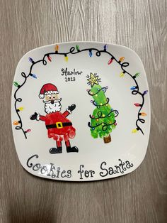 a plate with a santa and a christmas tree on it