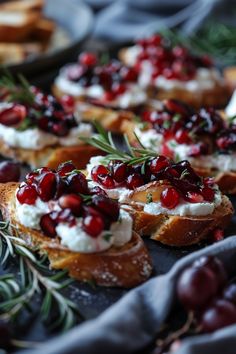 cranberry and goat cheese appetizers on toasted bread with rosemary sprigs