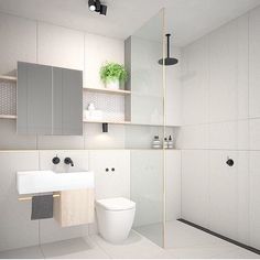 an image of a bathroom with white walls and flooring on the bottom right hand corner