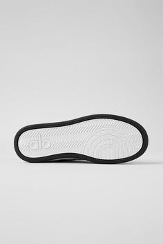 Meet the Alo Recovery Mode Sneaker: The first shoe that’s engineered for performance recovery and designed for a clean, modern, streetwear look. It has a structured, supportive outer sole and a high-rebound foam insole to support balance and pressure points for all-day recovery. Made from cruelty-free vegan leather and recycled components, the revolutionary tech and abrasion-tested rubber ensure that it lasts three times longer than any other street shoe on the market. Bottom line: the Alo Recov Functional High-top Sneakers With Contrast Sole, Textured Sole Slip-on Sneakers For Streetwear, White Studded Slip-on Sneakers For Streetwear, Functional Slip-on Sneakers With Textured Sole For Streetwear, Casual Carbon Color Sneakers With Rubber Sole, Functional High-top Sneakers With Textured Sole For Sports, Functional High-top Sneakers For Sports With Textured Sole, Functional Slip-resistant Sneakers With White Sole, Functional Slip-on Sneakers With Textured White Sole